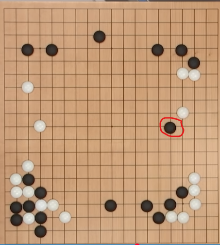 Go board with AlphaGo's unconventional Move 37 circled in red